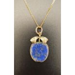 UNUSUAL LAPIS LAZULI APPLE PENDANT in nine carat gold mount and on nine carat gold chain