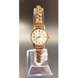 LADIES OMEGA WRISTWATCH the champagne dial with baton five minute markers, on expanding bracelet