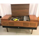 ULTRA MUSIC CENTRE in a teak case with a central lift up lid revealing a record player and tuner