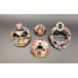 FOUR SCOTTISH AGATE AND GEM SET SILVER BROOCHES of various designs set with gemstones and agates