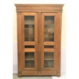 EARLY 19TH CENTURY FRENCH PROVINCIAL OAK ARMOIRE with a moulded pediment above a pair of paneled