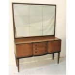 BOW FRONT FIGURED WALNUT SIDEBOARD with a later mirror back, above three central bow front drawers