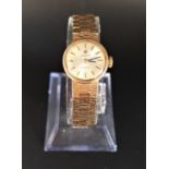 LADIES 1970s TISSOT STYLIST NINE CARAT GOLD WRISTWATCH the dial with five minute baton markers,