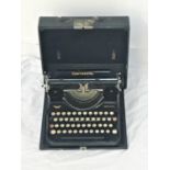 CONTINENTAL TYPEWRITER in a hard shell travel case