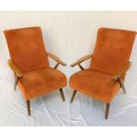 PAIR OF RETRO RECLINING ARMCHAIRS with padded button backs and seats with shaped beech arms with