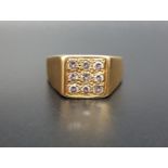 DIAMOND SET EIGHTEEN CARAT GOLD DRESS RING the nine diamonds in square setting totaling