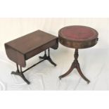 MAHOGANY DRUM TOP OCCASIONAL TABLE with an inset red leather top above three frieze drawers and