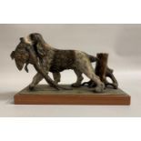 SPELTER SPANIEL RETRIEVING A PHEASANT BIRD MATCH STRIKER/HOLDER raised on a wooden base, 14cm high