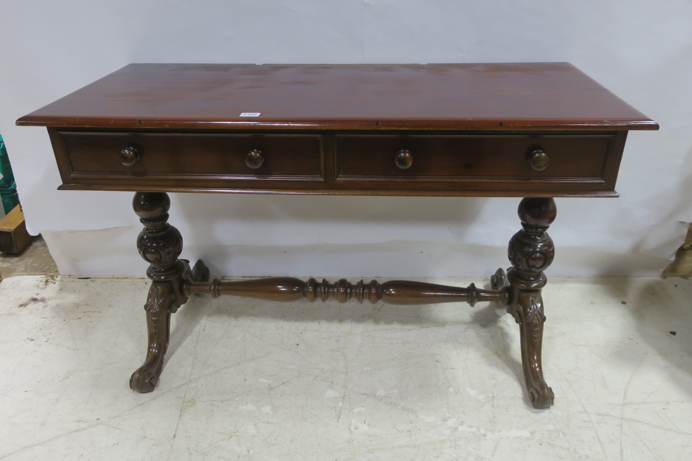 A 19TH CENTURY MAHOGANY SIDE TABLE of rectangular outline with two frieze drawers raised on dual