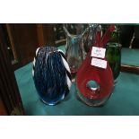 FOUR PIECES OF COLOURED ART GLASS to include vases and a shaped centrepiece