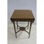 A MAHOGANY AND SATINWOOD CROSS BANDED OCCASIONAL TABLE of rectangular bowed outline with frieze