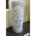 A CHINESE GLAZED POTTERY STICK STAND of cylindrical form the white and pink ground decorated with