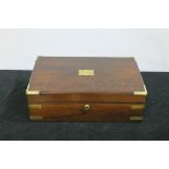 A GOOD GEORGIAN ROSEWOOD AND BRASS BOUND STATIONERY BOX the rectangular hinged lid containing a