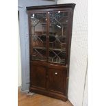A GOOD GEORGIAN MAHOGANY CORNER CABINET the moulded cornice above a pair of astragal glazed doors
