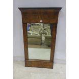 A BIEDERMEIR FIGURED WALNUT FRAME MIRROR the rectangular plate within a moulded frame 115cm x 68cm