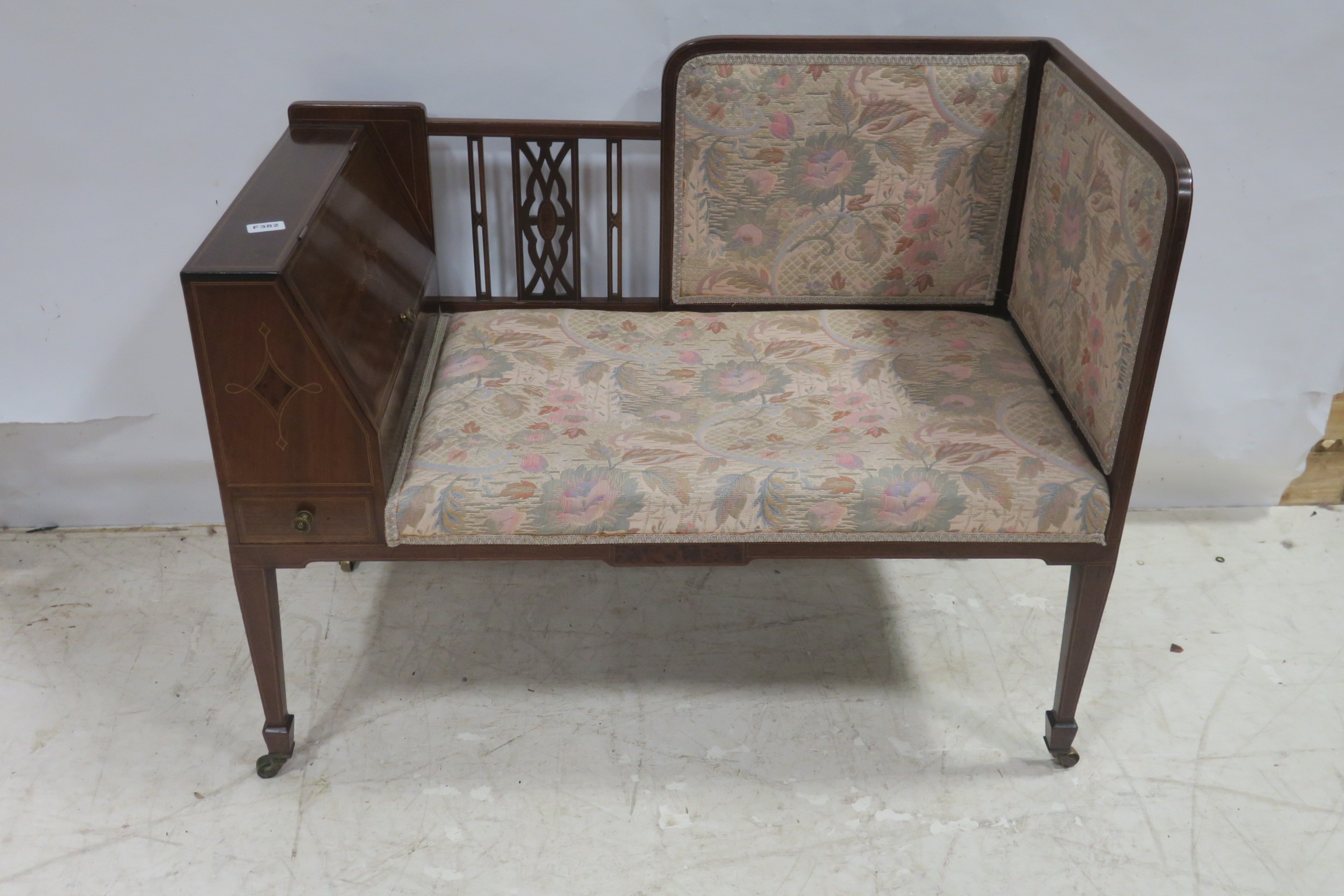 A 19TH CENTURY MAHOGANY INLAID AND UPHOLSTERED SETTEE the shaped top rail with pierced vertical