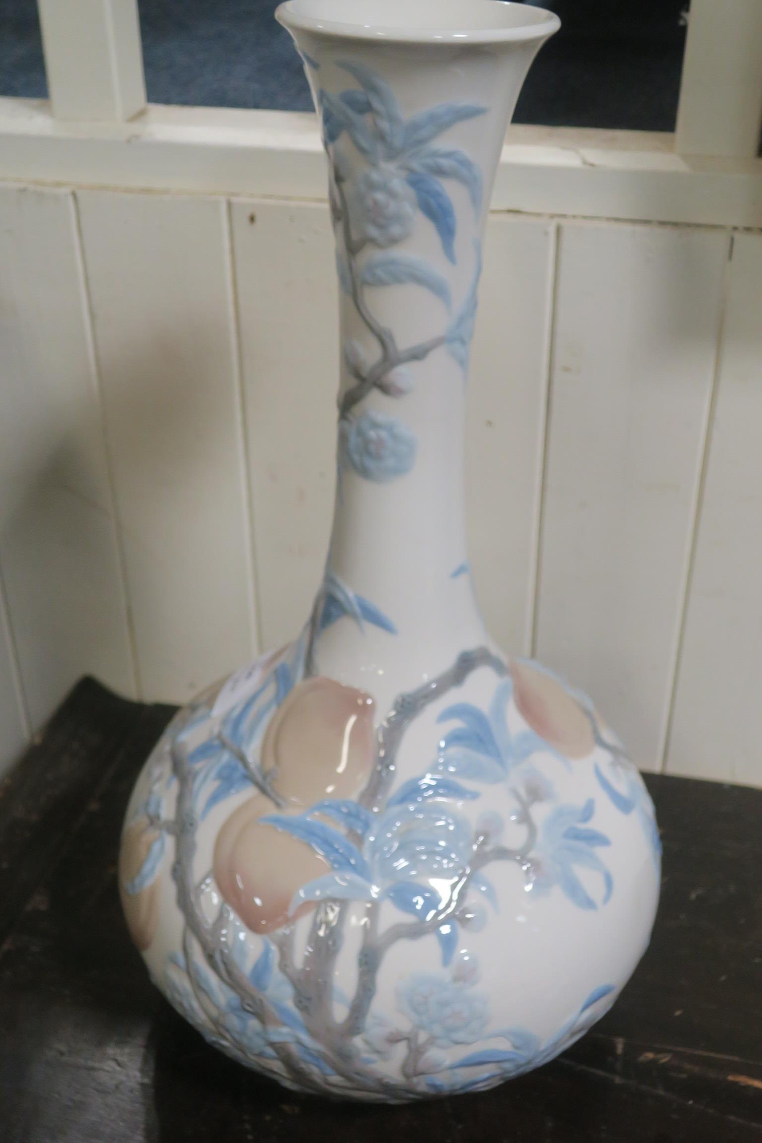 A FINE LLADRO VASE of bulbous form the white ground decorated with fruiting vines and flower heads