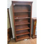 A CANADIAN STAINED WOOD SIX TIER OPEN FRONT BOOKCASE with moulded cornice raised on shaped bracket