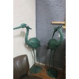 A PAIR OF BRONZED FIGURES each modelled as a heron shown standing on a naturalistic base 142cm (h)