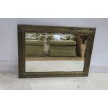 A CONTINENTAL GILT FRAMED MIRROR the rectangular bevelled glass plate within a reeded frame with