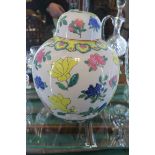 AN ORIENTAL LIDDED GINGER JAR of bulbous form the white ground decorated with flower heads and