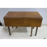 A GEORGIAN MAHOGANY DROP LEAF TABLE the rectangular hinged top above a frieze drawer on square