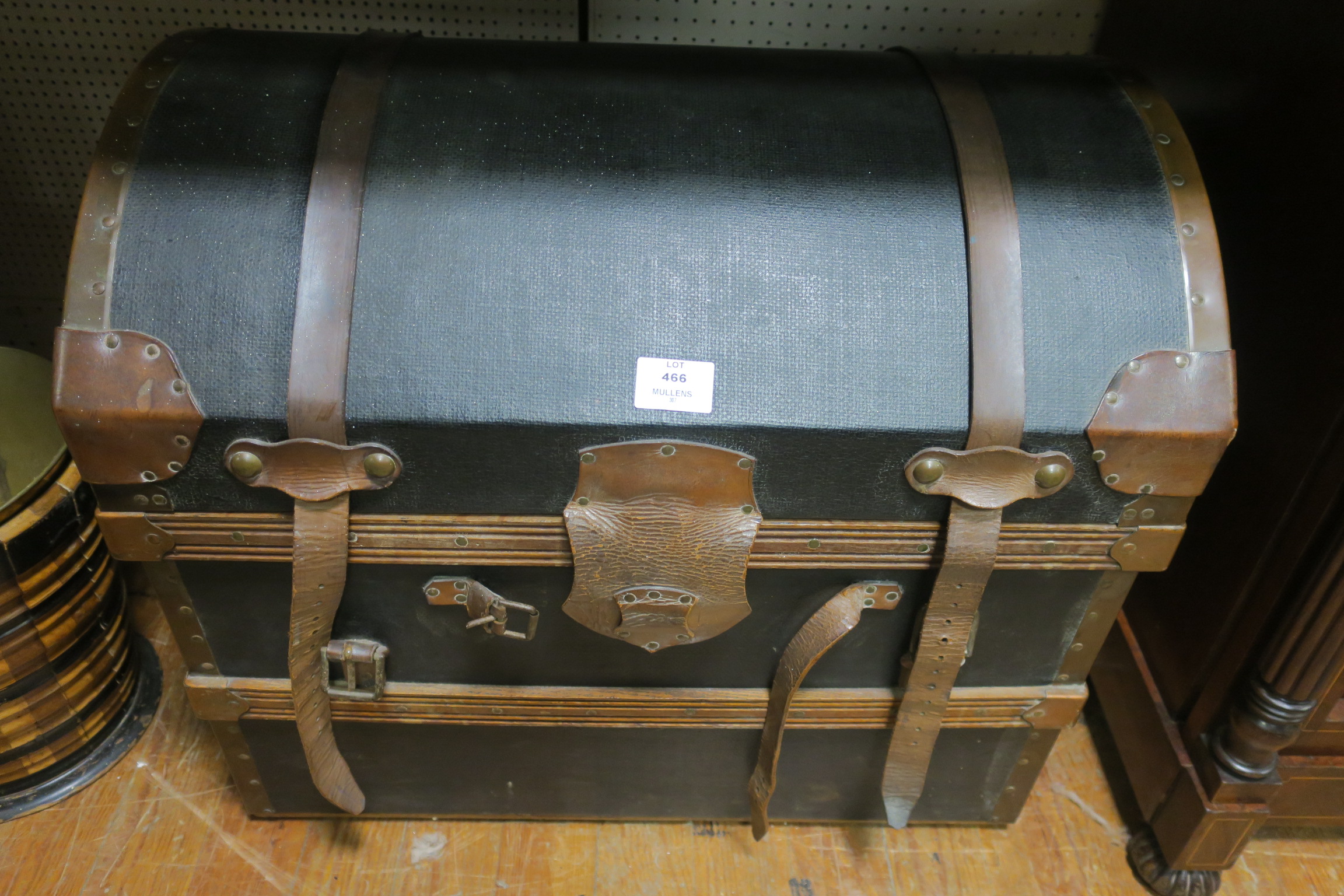 A CANVAS UPHOLSTERED AND COPPER BOUND DOME TOP TRAVELLING TRUNK,