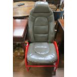 A PAIR OF RETRO HIDE UPHOLSTERED JAGUAR CAR SEATS raised on a red metal base with pierced sides