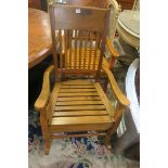 A PAIR OF BEECHWOOD ROCKING CHAIRS,