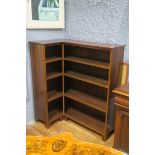 A MAHOGANY CORNER OPEN FRONT BOOKSHELF the shaped top above four open shelves 133cm (h) x 120cm (w)