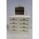 A CREAM PAINTED CHEST of rectangular outline the shaped top above eight long drawers with glazed