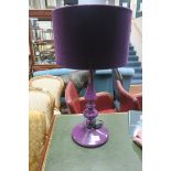 A PAIR OF PURPLE TABLE LAMPS each with knopped column above a circular spreading foot with shades