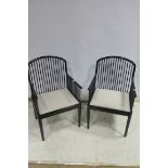 A SET OF FOUR DAVIS ALLEN FOR MONTINA BLACK LACQUERED ELBOW CHAIRS,