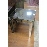 A CONTINENTAL MIRRORED OCCASIONAL TABLE of rectangular form on tapering legs 44cm (h) x 39cm (w) x