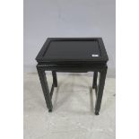 AN ORIENTAL HARDWOOD AND EBONISED DISH TOP TABLE of rectangular outline with moulded apron on