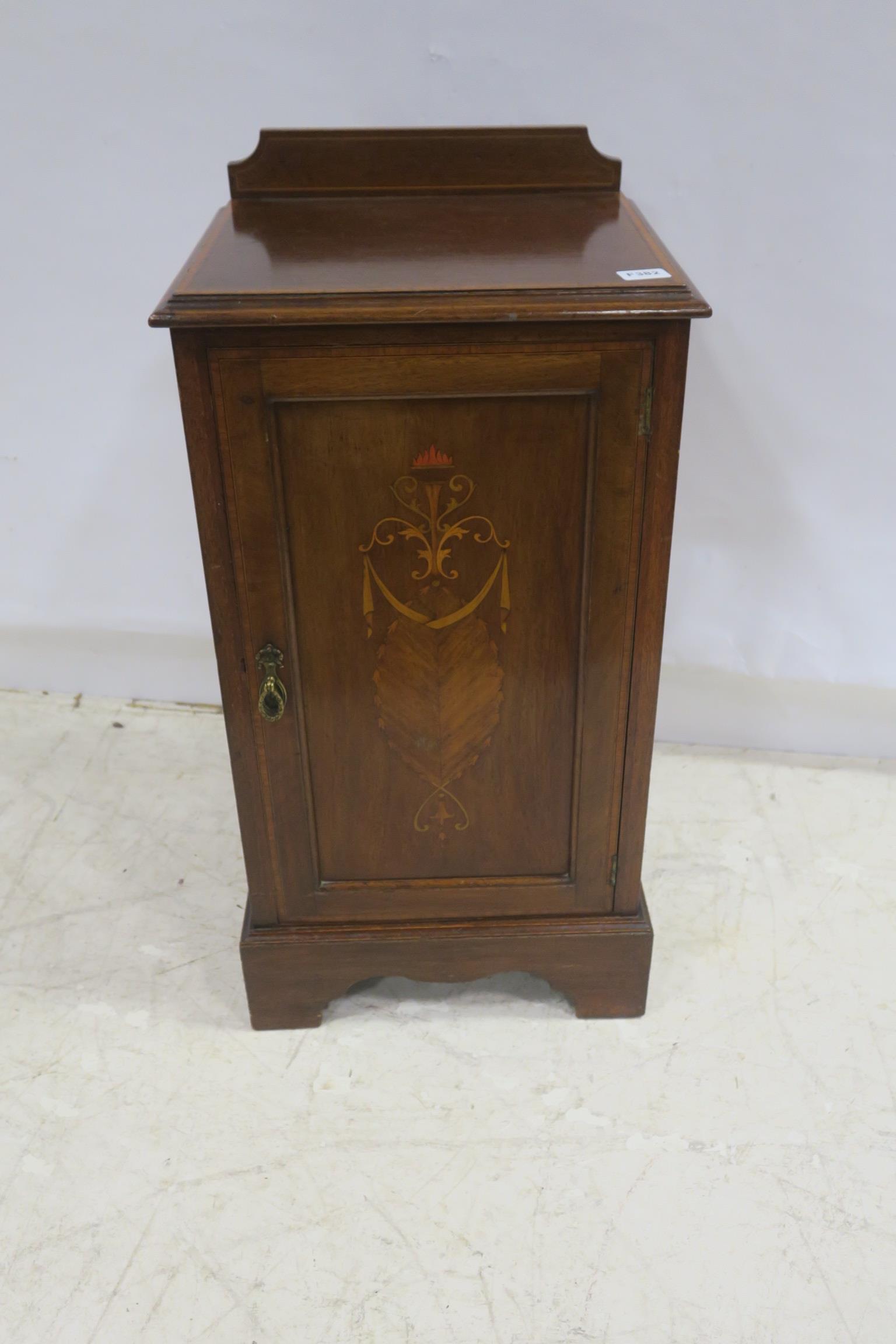 A 19TH CENTURY MAHOGANY AND SATINWOOD INLAID PEDESTAL the rectangular top with moulded back above a