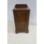 A 19TH CENTURY MAHOGANY AND SATINWOOD INLAID PEDESTAL the rectangular top with moulded back above a