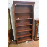 A CANADIAN STAINED WOOD SIX TIER OPEN FRONT BOOKCASE with moulded cornice raised on shaped bracket