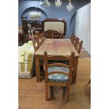 A NINE PIECE HARDWOOD BREAKFAST SUITE comprising eight ladder back chairs including a pair of elbow