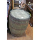 A PAIR OF OAK AND STEEL BOUND SPIRIT BARRELS inscribed Old Fitzgerald Distillery Bourbon Whiskey