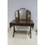 A REGENCY DESIGN MAHOGANY DRESSING TABLE the superstructure with tryptic mirror above a rectangular