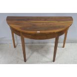 A PAIR OF ELM WOOD SIDE TABLE of demi lune outline the shaped top raised on square moulded legs