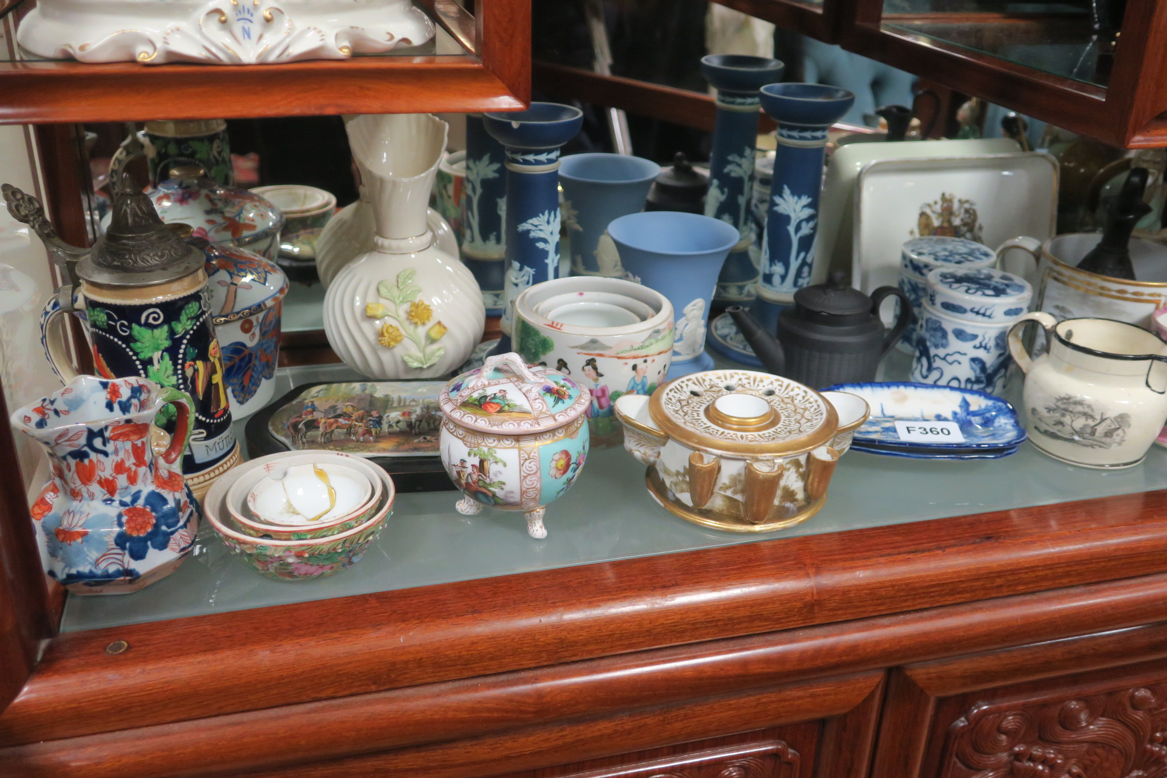 A COLLECTION OF CHINA to include a pair of Wedgewood candlesticks a mason jug a spode china lidded