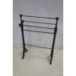 A 19TH CENTURY MAHOGANY FIVE BAR TOWEL RAIL on splayed legs