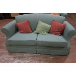 A MODERN THREE SEATER SETTEE together with a two seater settee with green upholstery and loose