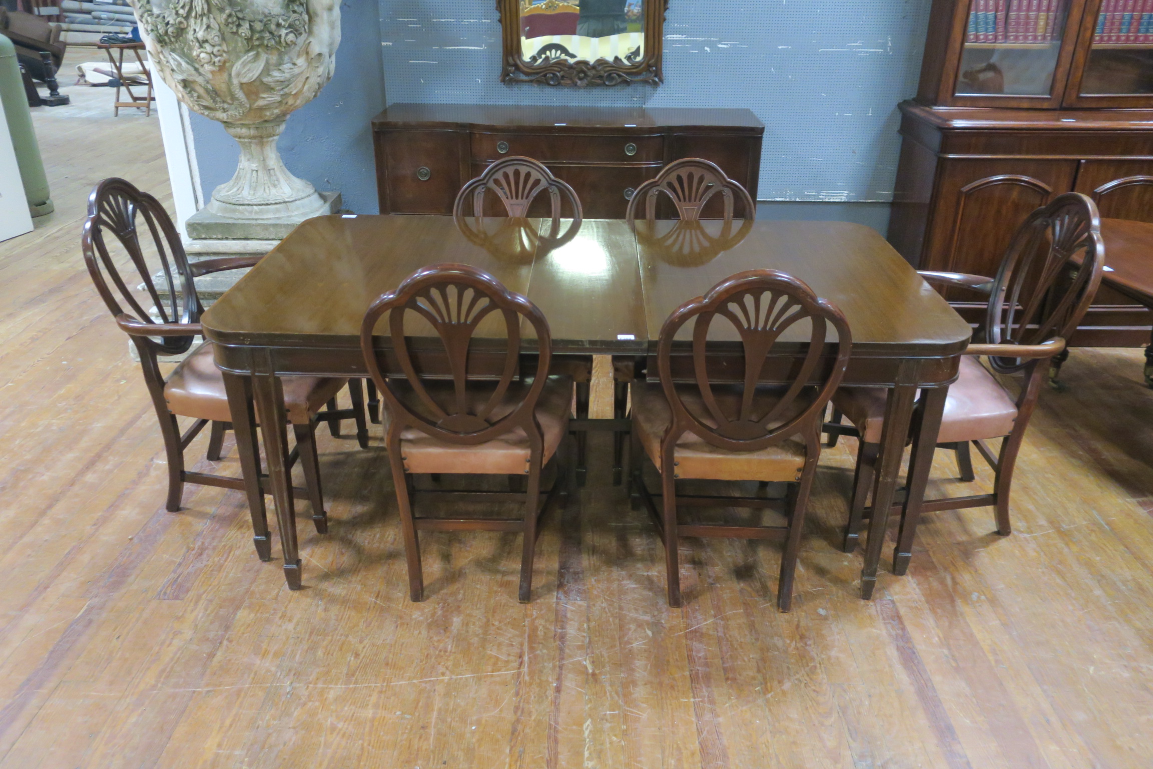 AN EIGHT PIECE HEPPLEWHITE DESIGN MAHOGANY DINING SUITE comprising six chairs including a pair of