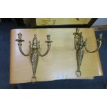 A PAIR OF BRASS TWO BRANCH WALL LIGHTS with spiral twist columns with conforming back plate 47cm