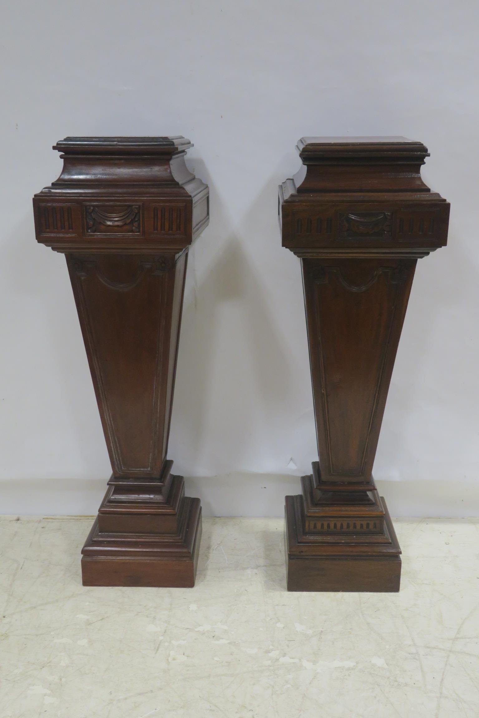 A PAIR OF HEPPLEWHITE DESIGN MAHOGANY PEDESTALS each of square tapering form with stepped tops