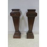 A PAIR OF HEPPLEWHITE DESIGN MAHOGANY PEDESTALS each of square tapering form with stepped tops