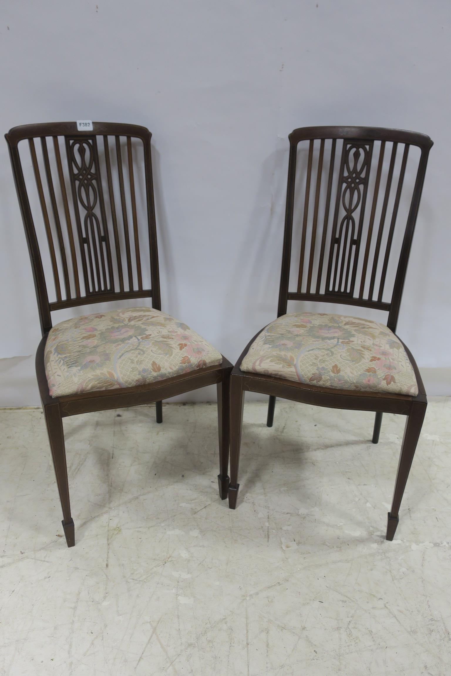 A GOOD PAIR OF 19TH CENTURY MAHOGANY AND SATINWOOD INLAID SALON CHAIRS each with a curved top rail